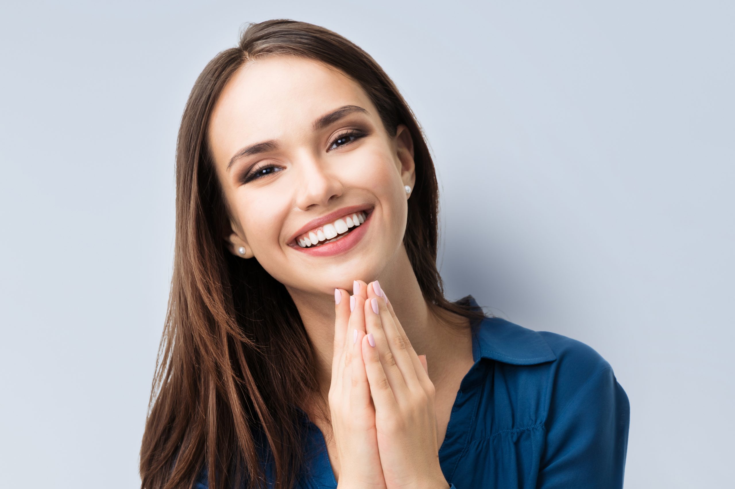 woman smiling with arms up - Fermelia Dental
